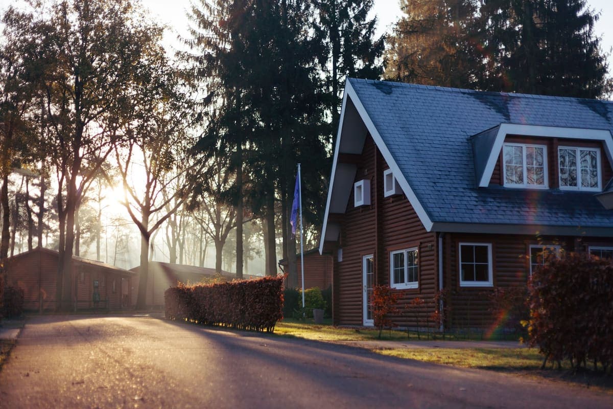 Gambrel-roof house at sunrise